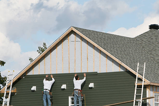 Professional Siding technician working in Sterling, VA